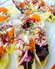Tulip Tree Creamery - Nettle cheese served on Belgian endive boats with roasted beets, citrus, seafood salad, sprouts, nuts, and a creamy dressing.