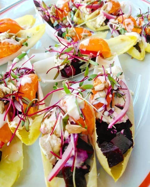 Tulip Tree Creamery - Nettle cheese served on Belgian endive boats with roasted beets, citrus, seafood salad, sprouts, nuts, and a creamy dressing.