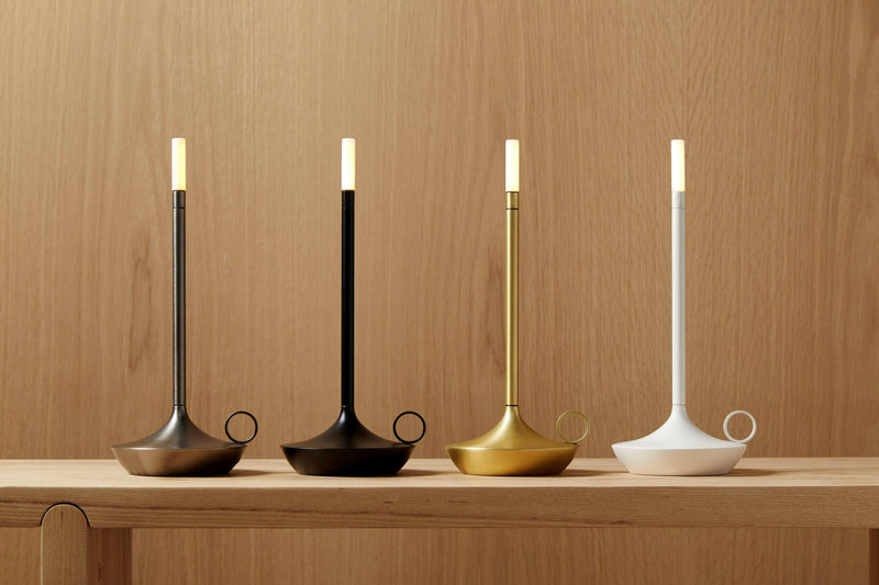 VANMOKUM | GRAYPANTS Wick Portable Rechargeable Lamp on a shelf, showcasing its sleek design and functionality, embodying ambiance and versatility in any setting.