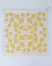 Hearth and Harrow - Ginkgo Leaf Tea Towel - Organic Cotton - Oversized 30 x 30, features yellow ginkgo leaves, eco-friendly print, hanging with clothespins.