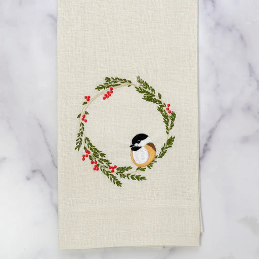 Chickadee Wreath Towel, Cream: 100% linen towel with embroidered winter wreath and chickadee, perfect for adding whimsical charm to your kitchen decor.