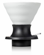 HARIO USA - HARIO Ceramic Immersion Dripper 02 SWITCH in white, with black holder, for precise pour-over and immersion coffee brewing.