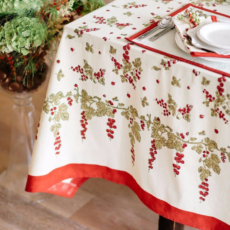 Couleur Nature - Gooseberry Red & Green tablecloth with berry and leaf pattern, enhancing a dining table with casual elegance, part of Athens Cooks' curated kitchen collection.