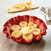 Emile Henry | Deep Ruffled Pie Dish with pears and batter, showcasing its even heat distribution and elegant ruffled design for perfect baking results.