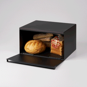 Yamazaki Home | Tower Bread Box in matte-black holding an artisan loaf, baguette-style rolls, and pre-sliced bread, perfect for organized and stylish kitchen storage.