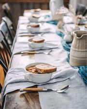 Farmhouse Pottery - Silo Soup Mug: Soup Mug on a rustic table, filled with stew and topped with bread, showcasing its ergonomic handle and versatile design.