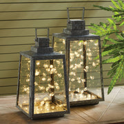 Napa Home & Garden - Napa Night Sky LED Mini Globe Lights in glass lanterns, perfect for enhancing evening outdoor gatherings. Battery-operated, 24.6 feet long.
