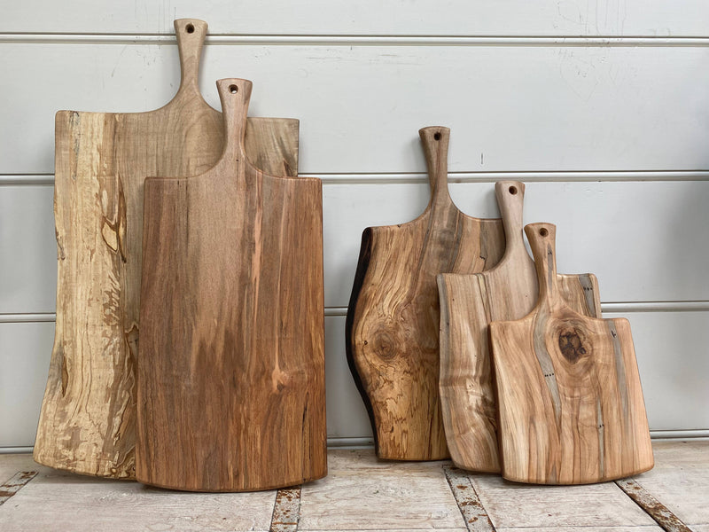 Petermans Boards and Bowls Inc. - 27 Ambrosia Maple Serving Board with Handle, showcasing an elegant, handcrafted design, perfect for serving or cutting, sustainably made in New England.