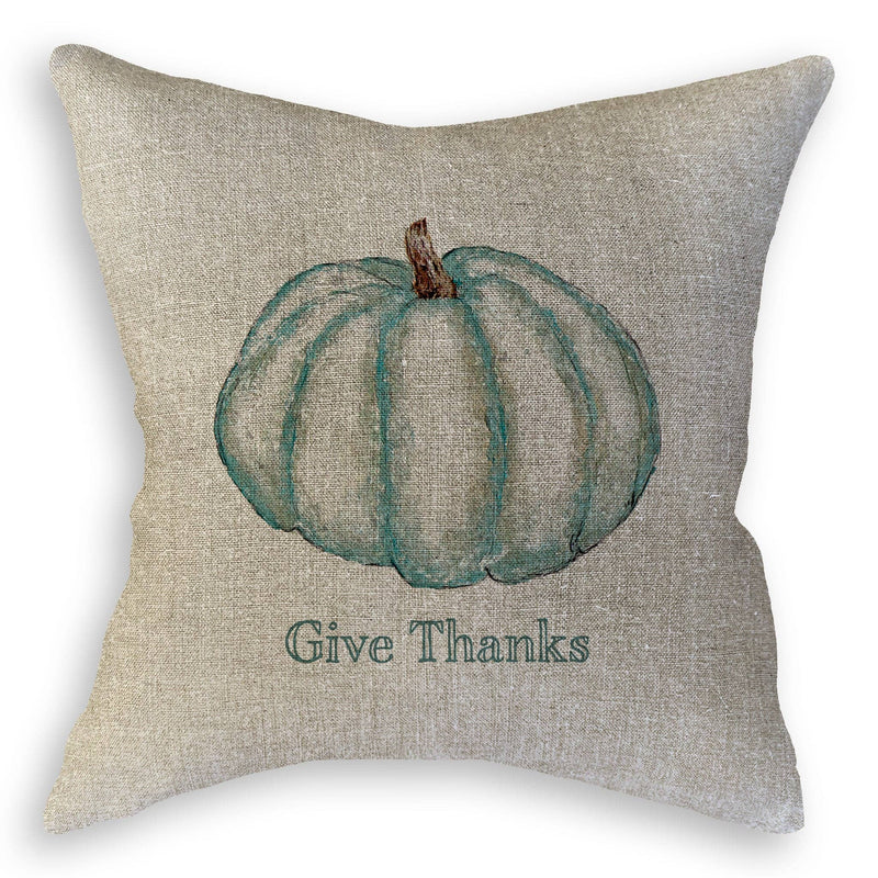 French Graffiti - Blue Pumpkin throw pillow featuring a watercolor-style teal pumpkin and Give Thanks text, ideal for enhancing kitchen or dining spaces.