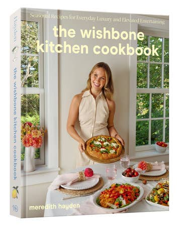Cover of ‘The Wishbone Kitchen Cookbook’ by Meredith Hayden, featuring colorful dishes and a kitchen backdrop, embodying effortless elegance for Athens Cooks' culinary enthusiasts.