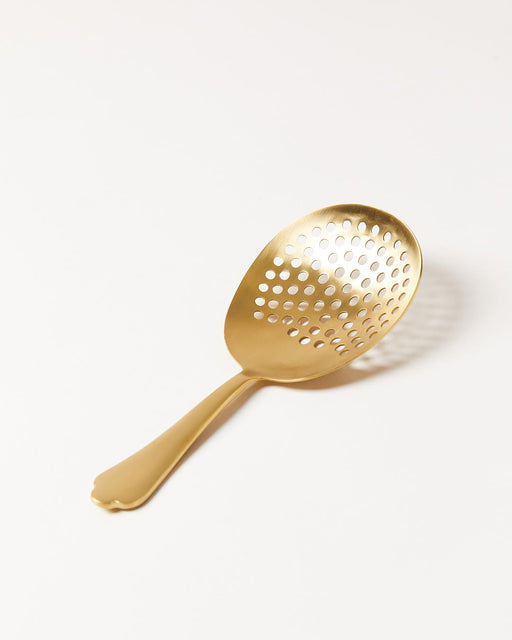 Farmhouse Pottery | Essex Barware, Julip Strainer - Brushed Gold: A gold, perforated spoon ideal for straining solids from liquids, perfect for enhancing your kitchen tool collection.