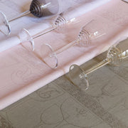 Le Jacquard Francais | Linen Crystal Towel, Blackpepper, featuring delicate crystal glassware motifs, with six clear wine glasses displayed atop, ideal for drying fine glassware.