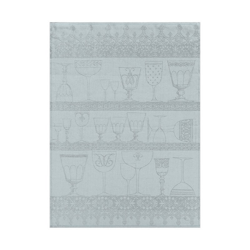 Le Jacquard Français | Cristal Tea Towel, Mist: A decorative linen towel featuring light blue/gray illustrated glassware on shelves with ornamental borders, ideal for drying delicate dishes.