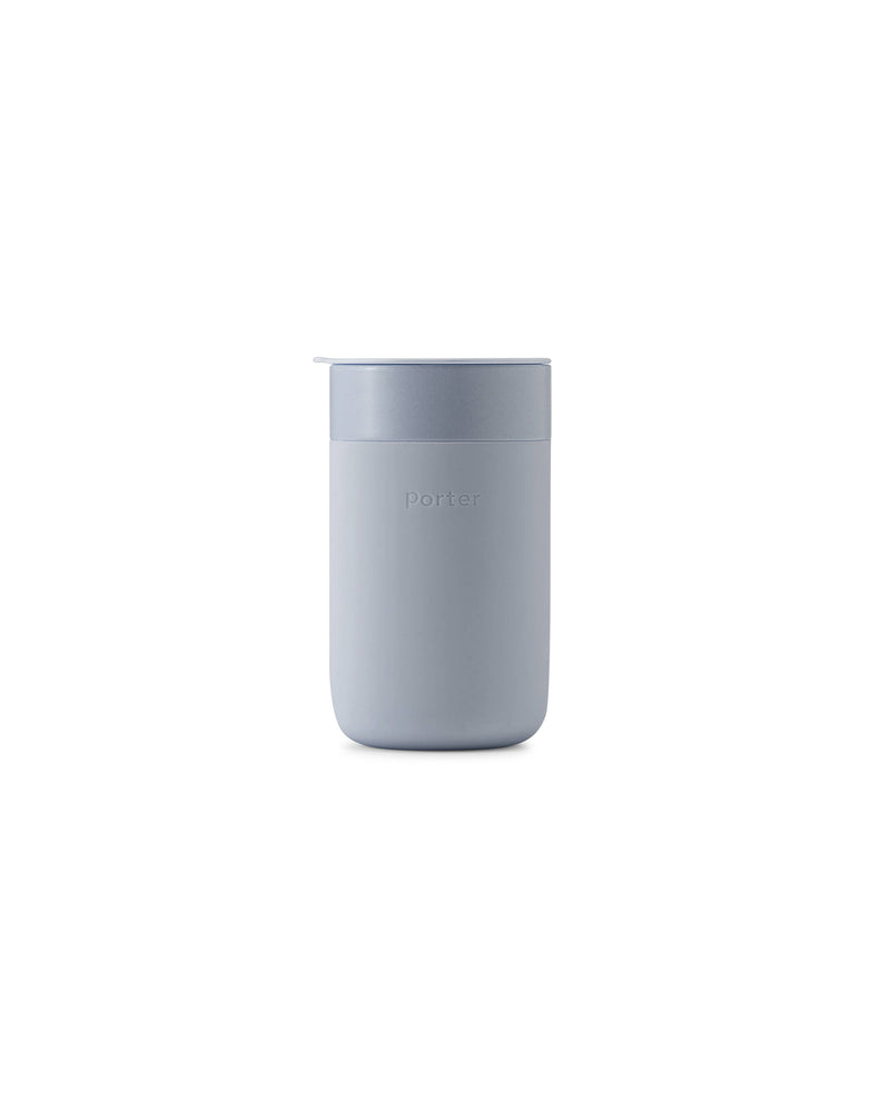 W&P - Ceramic Reusable Coffee Mug 16oz: Charcoal, featuring a white container with a soft silicone sleeve and a BPA-free press-fit lid for stylish and eco-friendly sipping.