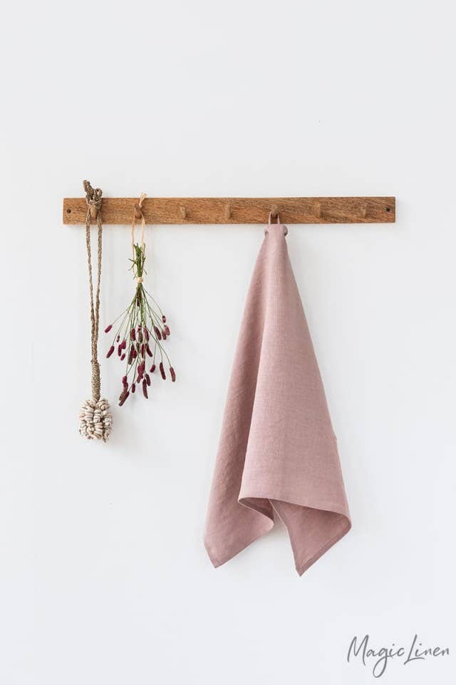 Linen tea towel hanging, featuring European linen, durable and absorbent, perfect for kitchen tasks. Includes a hanging loop. Ideal for eco-friendly kitchens.
