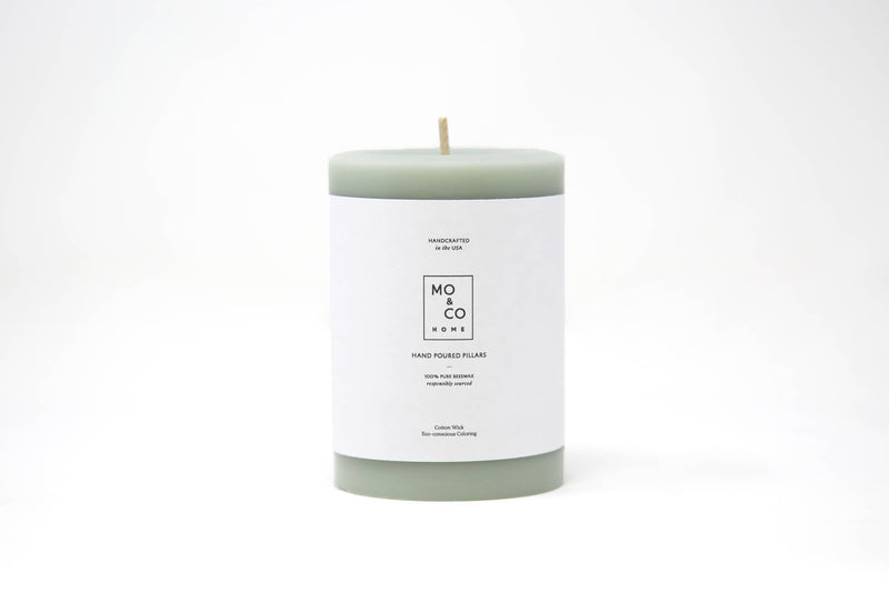 Mo&Co Home - 100% Beeswax Pillar Candle in Eucalyptus scent, hand-poured, eco-friendly, with a white label. Available in 3x4 inches, ideal for home decor.