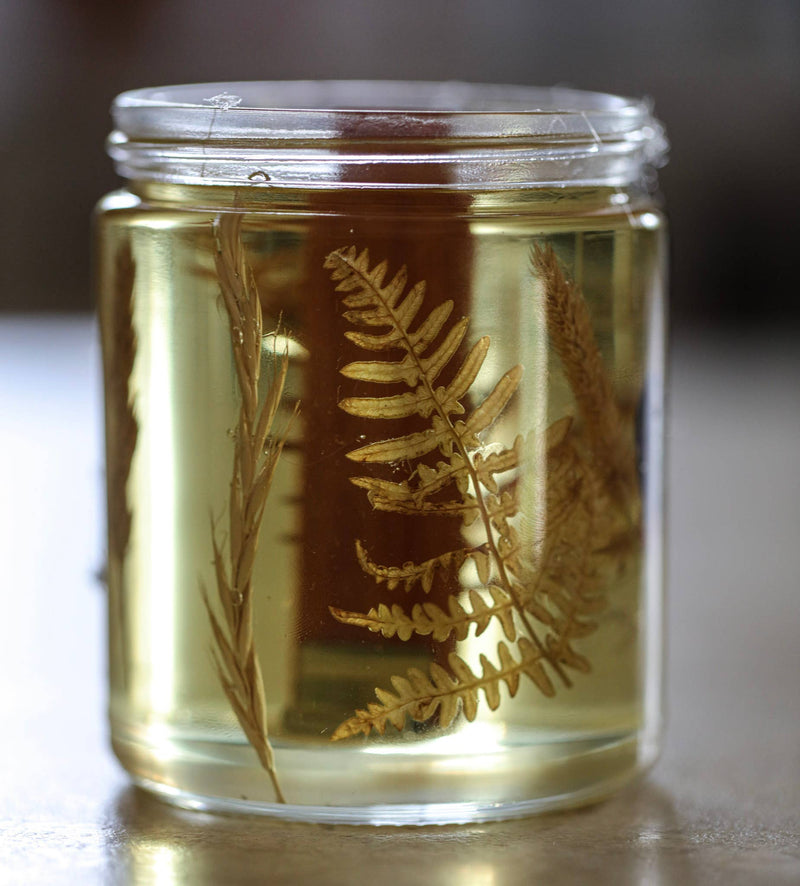 Among the Flowers - Essential oil candle | HOLIDAY: Hearth, featuring dried botanicals in gel wax. Perfect for adding a festive, handcrafted touch to your home.