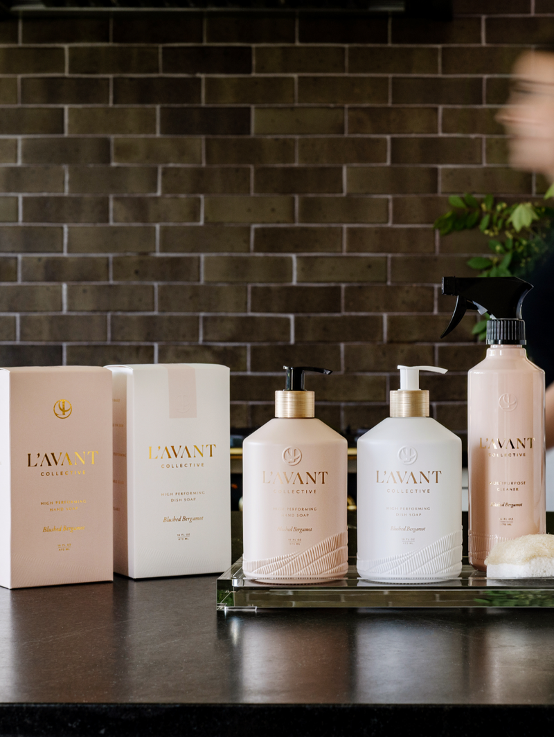L'AVANT Collective - High Performing Hand Soap - Blushed Bergamot bottles displayed on a counter, offering a luxurious hand-washing experience with vibrant citrus scents.