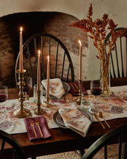 Autumn-inspired table setting highlighting Coral & Tusk - Autumn Blossoms Dinner Napkin in floral print, paired with elegant gold flatware and rustic dried foliage centerpiece.