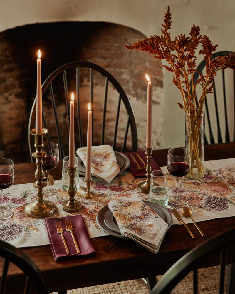 Autumn-inspired table setting highlighting Coral & Tusk - Autumn Blossoms Dinner Napkin in floral print, paired with elegant gold flatware and rustic dried foliage centerpiece.