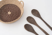 NEEPA HUT - Iris Tray I Yellow: A handwoven seagrass tray with a yellow circle, ideal for serving or display, crafted by artisans in the Philippines.