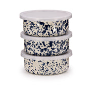 Crow Canyon Home - Splatter Enamelware 3-pc Storage Bowl Set: Blue Splatter features cream-colored, navy-speckled enamel bowls with lids, ideal for stylish, versatile serving.