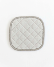 MagicLinen linen pot-holder, square-shaped, featuring quilted detailing and a hanging loop, ideal for heat protection in the kitchen.