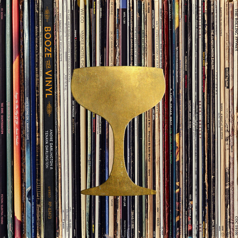 Booze & Vinyl: A guide to pairing cocktails with classic records, featuring a golden coupe glass over vinyl spines, perfect for music-themed gatherings.
