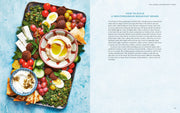 Penguin Random House LLC - The Mediterranean Dish: A cookbook spread showcasing a vibrant Mediterranean mezze breakfast board with dips, veggies, pita, and cheeses, alongside assembly tips.
