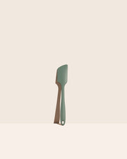 GIR Get It Right - GIR Ultimate Spatula: Sage on a white surface; a versatile, heat-resistant kitchen tool ideal for mixing and maneuvering, featuring a seamless, hygienic design.