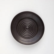 Gravesco Pottery - Garlic Grater Plate in Black, featuring a concentric-circle pattern for effortless garlic preparation, suitable for oils and dips, handcrafted and uniquely wheel-thrown.