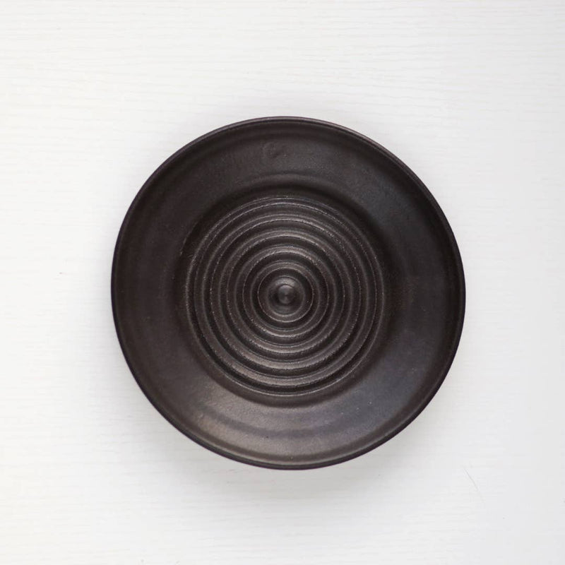 Gravesco Pottery - Garlic Grater Plate in Black, featuring a concentric-circle pattern for effortless garlic preparation, suitable for oils and dips, handcrafted and uniquely wheel-thrown.