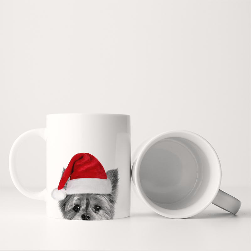 Perkie Prints - Santa Hat Yorkie Mug, featuring a Yorkie in a Santa hat on a white ceramic mug, shown upright and on its side.