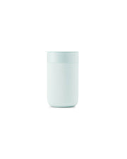 W&P - Ceramic Reusable Coffee Mug 16oz: Charcoal, featuring a white container with a blue lid, silicone sleeve, and splash-resistant, BPA-free press-fit lid.