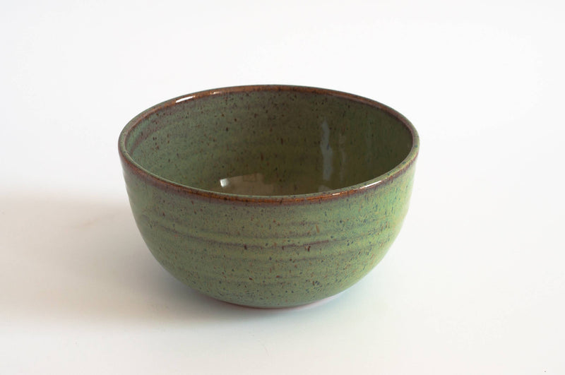 RachaelPots - Laura Bowl: Sage, a speckled green ceramic bowl with ribbed sides and a brown rim, perfect for versatile bowl-meals, hand-thrown in Brooklyn.