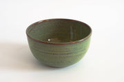 RachaelPots - Laura Bowl: Coral, a handcrafted speckled green ceramic bowl with a ribbed exterior, ideal for versatile meal use.