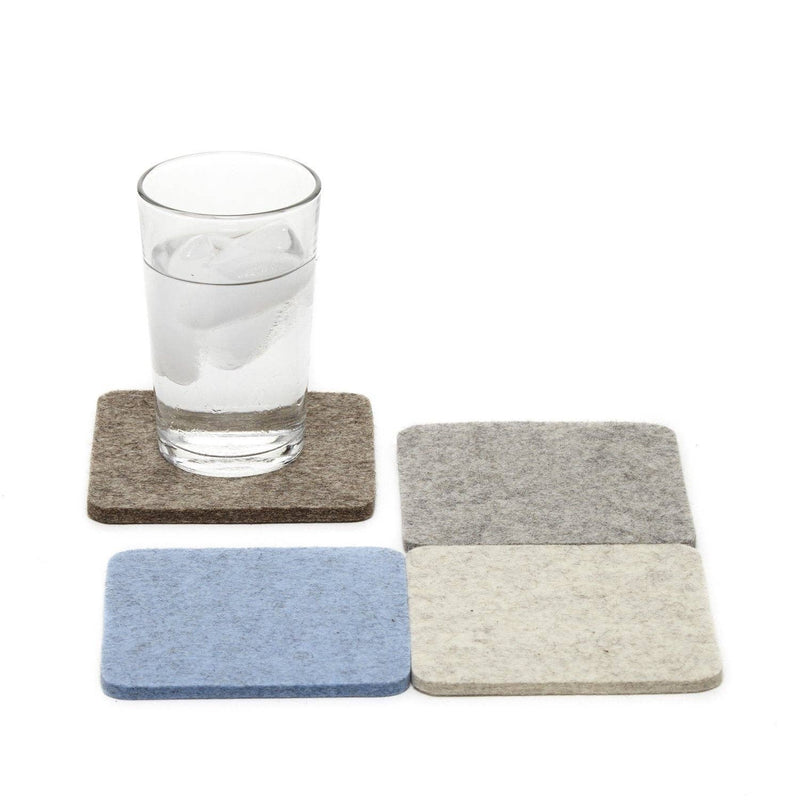 Glass of water on Graf Lantz - Bierfilzl Merino Wool Felt Square Coaster Multi 4 Pack, showcasing durable, stylish coasters ideal for kitchen use.
