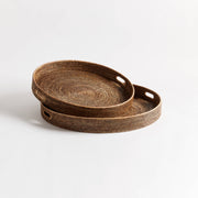 Close-up of Napa Home & Garden Burma Rattan Round Ottoman Trays, showcasing the intricate weave, ideal for serving or styling, available as a set of two.