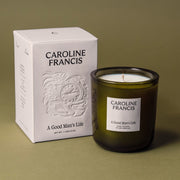 Caroline Francis | A Good Man's Life coconut soy wax candle in a glass jar with packaging, offering a 45-50 hour burn time. Hand-poured, non-toxic fragrance oils.