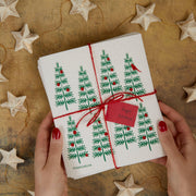 Three Bluebirds Swedish Dishcloths featuring a whimsical white and gold starfish design on a sturdy, biodegradable cloth, perfect for sustainable kitchen chores.