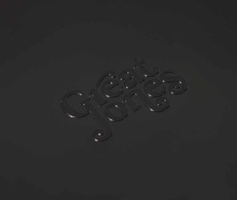 Great Jones | Little Sheet - Pepper: Close-up of a nonstick, nontoxic quarter-sized sheet pan, ideal for personal baking or reheating, from Athens Cooks kitchen store.