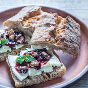 Rustic sandwich with soft cheese, walnuts, mint, and Southern Roots Sisters - Triple Berry Jam, highlighting its versatility for breakfast or brunch at Athens Cooks.