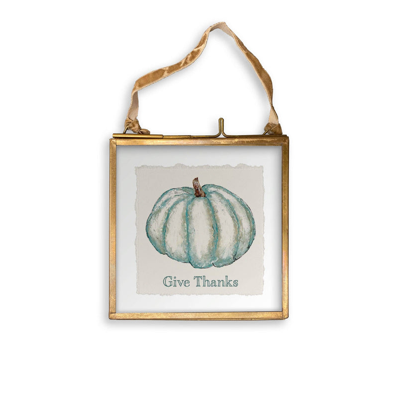 French Graffiti - Blue Pumpkin: Natural Guest Towel features a small brass-framed glass picture with a teal watercolor pumpkin and “Give Thanks” text, perfect for Thanksgiving décor.