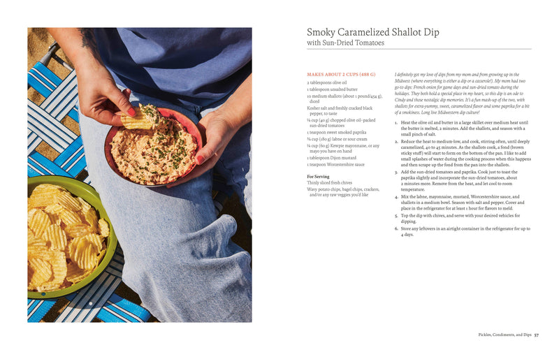 Cookbook spread from By Heart featuring a person enjoying Smoky Caramelized Shallot Dip with Sun-Dried Tomatoes, accompanied by the recipe on the opposite page.