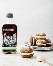 Runamok - Peppermint Bark Organic Maple Syrup 250ml bottle with whoopie pies and frosting, highlighting a unique holiday syrup flavor with mint, cocoa, and maple.