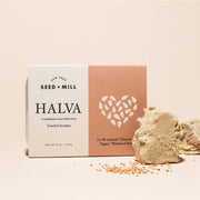 Seed + Mill - Toasted Sesame Halva, 227g box on a white surface, showcasing its flaky sesame candy texture. Ideal for desserts or charcuterie boards.