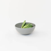 Sarah Kersten - Ramen Bowl: Black, shown with leafy greens, ideal for versatile kitchen use, perfect for salads, noodles, or side dishes.