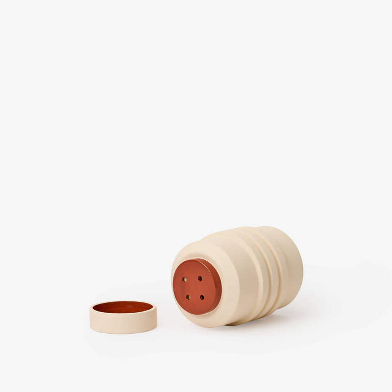 Areaware - Strata Plant Vessel: Blue, a ceramic planter with layered shapes concealing a saucer, inspired by sculptural heritage.