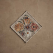 Coral & Tusk - Autumn Blossoms Dinner Napkin with embroidered fall flowers, including mums and daisies, on beige linen, ideal for seasonal dining at Athens Cooks.