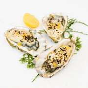 Villa Jerada - Urfa Biber - 50g complements oysters on the half-shell, topped with creamy dressing, breadcrumbs, and herbs, enhancing the dish's complexity with mild spice and smokiness.